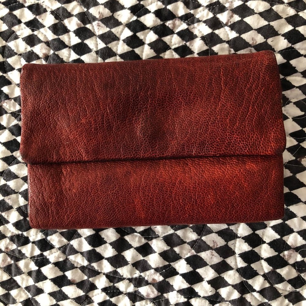 Rust colored, distressed leather wallet